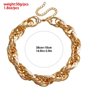 Detail showing chunky gold geometric chain links with size and weight measurements
