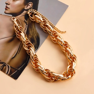 Detailed macro shot of the golden chunky chain necklace with lobster clasp and extender