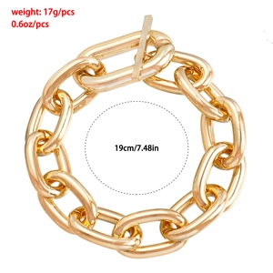 Close-up of gold tone link bracelet showing 19cm length and T-bar toggle clasp detail