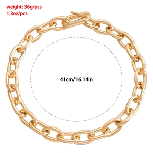 Detail of chunky gold geometry link necklace with OT clasp and 41cm length specifications