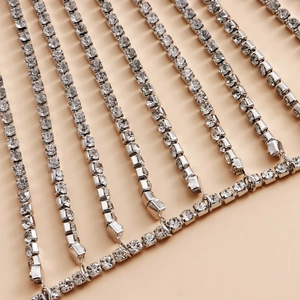 Macro detail of silver rhinestone fringe body chain with clear crystal tassel rows