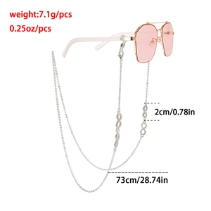 Detail showing an infinity symbol eyewear chain in silver with silicone loop connectors