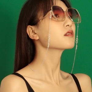 Fashion sunglasses with oversized gradient lenses and a diamond infinity symbol chain