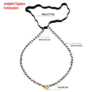Detail of beaded thigh chain with gold floral charms and elastic band specifications