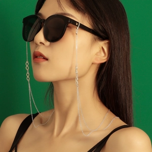 Silver infinity link glasses chain on female model with green background stylish accessory