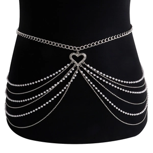 Detailed close-up of multilayer silver tassel body chain with pearls and heart pendant