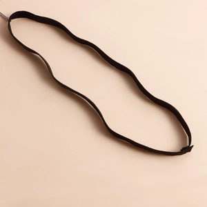 Close-up of elastic black woven leg chain with adjustable silver extension chain link
