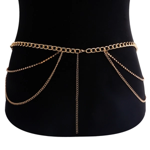 Detail of gold multi-layer waist chain with rhinestones and long fringe tassel on black mannequin