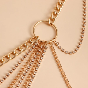 Detail of gold multi-layer body chain with rhinestones and large circular connector