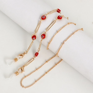 Gold eyeglasses chain featuring red evil eye beads and anti-slip silicone loops