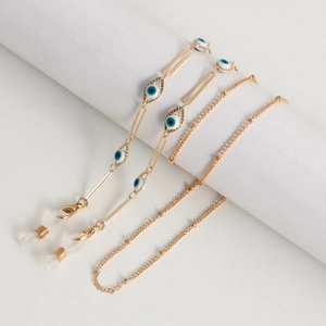 Golden Evil Eye eyewear chain with resin beads and adjustable silicone loops on white props