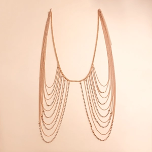 Detail of rose gold multi-layer rhinestone body chain with elegant draped thin link design