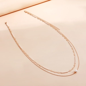 Chaîne de corps dorée à double couche pour femmes avec perles blanches et liens en cœur