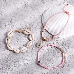 Bohemian three-piece anklet set with natural shells and pink evil eye beads for beach wear