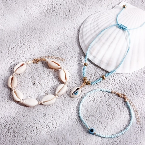 Three-piece Bohemian seashell and blue bead anklet set with evil eye charm for beach wear