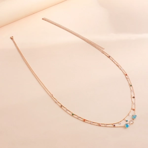 Double-layered rose gold body chain with colorful beads and blue butterfly pendant