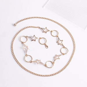 Close-up of golden starfish body chain with hollow stars, rhinestones and lobster clasp