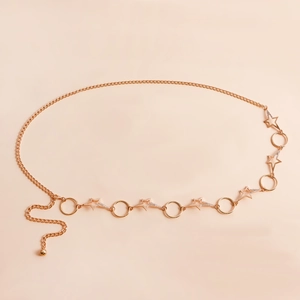 Detail of rose gold starfish and circle waist chain with sparkling crystal accents