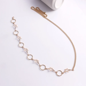 Detail of gold starfish and circle metal body chain with sparkling rhinestones
