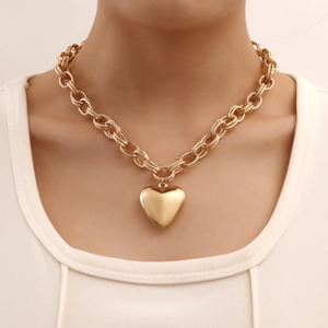 Golden chunky chain necklace featuring a large polished heart pendant for women