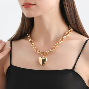 Chunky gold chain necklace featuring a large polished heart pendant for women fashion