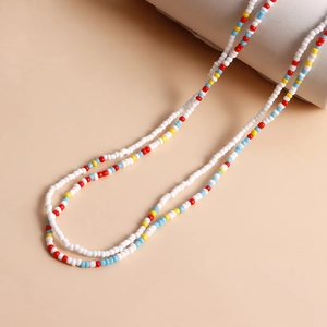 Detail of colorful seed beads and shell starfish charms for beach body chain sets