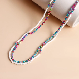 Detail of bohemian waist chain with colorful beads, starfish and golden accents