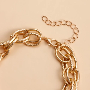 Detail of gold chunky link chain with lobster clasp and adjustable extension necklace