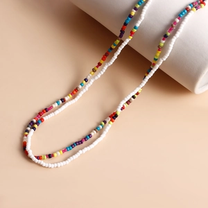 Detail of colorful seed bead body chain with seashells and starfish for beach style