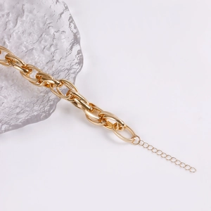 Close-up of chunky gold-toned O-chain link necklace with adjustable extension chain