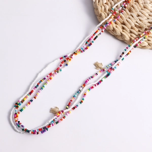 Detail of bohemian waist chains with colorful beads and golden turtle sea shell charms