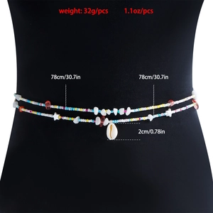 Close-up of beach waist chain with colorful beads, starfish and shell charm details