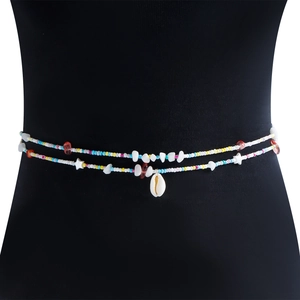 Detail of bohemian waist chain featuring colorful beads and a natural seashell pendant
