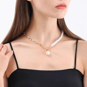 Minimalist OT toggle necklace featuring woven pearls and golden paperclip chain links