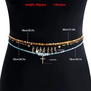 Detail of layered waist chain with colorful beads, EMPRESS letters and cross charm