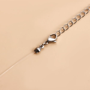 Detail of silver lobster clasp and adjustable extension chain on minimalist necklace