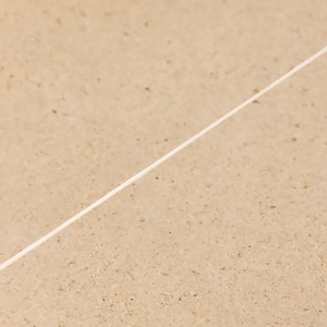 Macro view of transparent nylon cord and fine jewelry wire for zircon heart necklace
