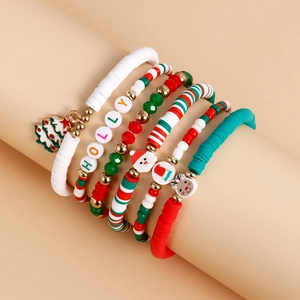 Detail of Christmas beaded bracelet set featuring Santa Claus charms and Holly letter beads