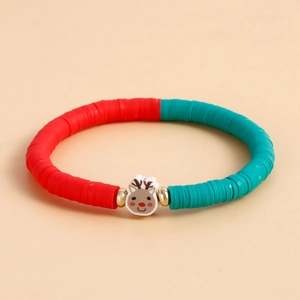 Close-up of Christmas polymer clay bracelet featuring a cartoon reindeer charm and beads