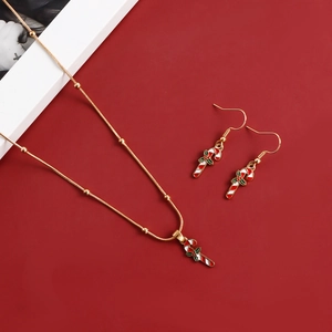 Detailed view of candy cane necklace and earrings set on festive red background