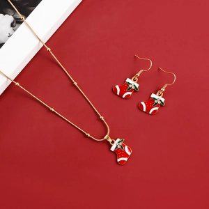 Detail view of festive red Christmas stocking pendant necklace and earring jewelry set