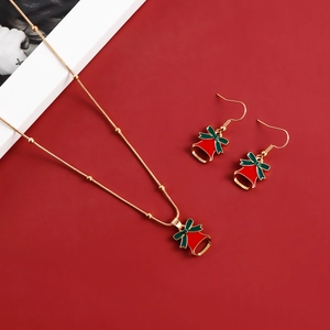 Detailed close-up of festive red Christmas bell necklace and earrings jewelry set