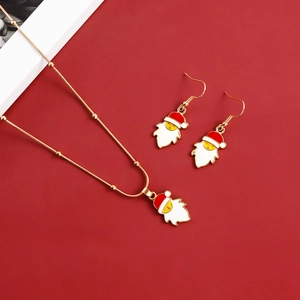 Christmas jewelry set with Santa Claus necklace and earrings on red background