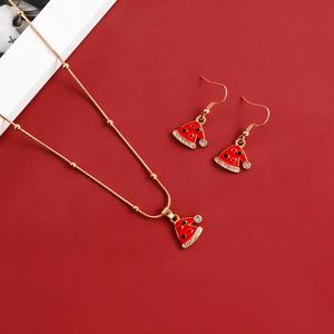 Close-up of a Christmas hat jewelry set with red enamel and sparkling crystal details