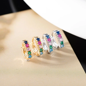 Detailed macro view of S925 silver huggie earrings with five multi-colored zircon stones