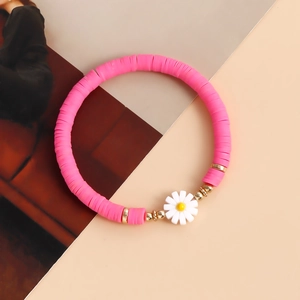 Bohemian colorful heishi bead bracelet with white daisy charm and gold spacers