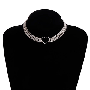 Close-up of elegant silver tiered rhinestone choker necklace with hollow heart detail