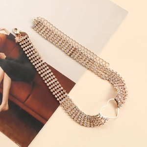 Detail of four-row rhinestone choker with gold heart charm and adjustable lobster clasp
