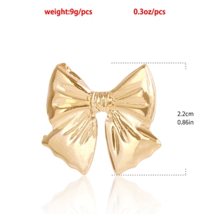Gold bow earrings measuring 2.2cm in height and weighing 9g with a high polish finish