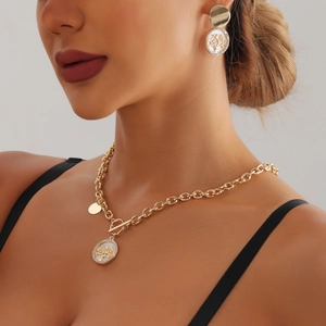 Gold life tree jewelry set with toggle necklace and mother of pearl drop earrings